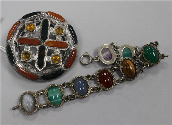 An early 20th century Scottish white metal and hardstone brooch and a Scottish white metal and multi cabochon stone bracelet.